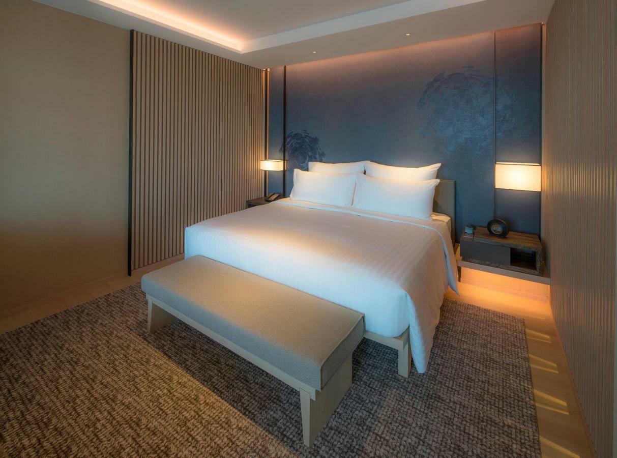 Mu Jiaoxi Hotel Екстер'єр фото A bedroom at the hotel